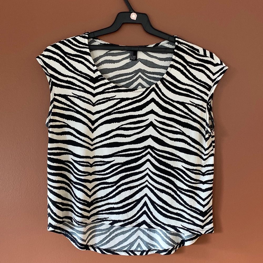 Forever 21 Ladys, zebra striped asymmetrical crop top.